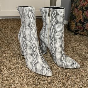 Heeled snake print boots